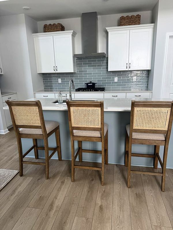 After: blue-gray tile backsplash and painted island